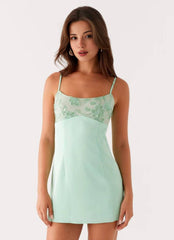 Sage green strapless mini dress with bead embellishments